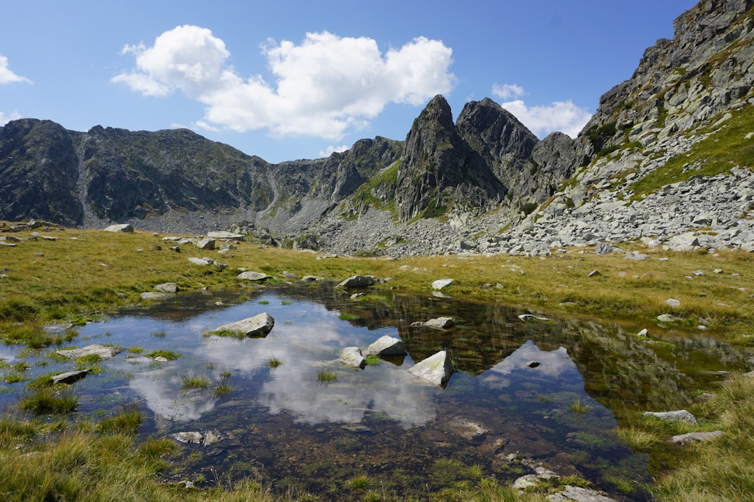 Balea Lake Romania glacial lake alpine peaks reflection